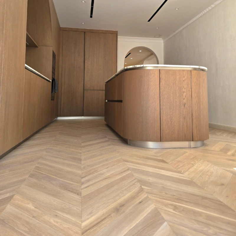 Chevron pattern semi-solid wood floor in a kitchen