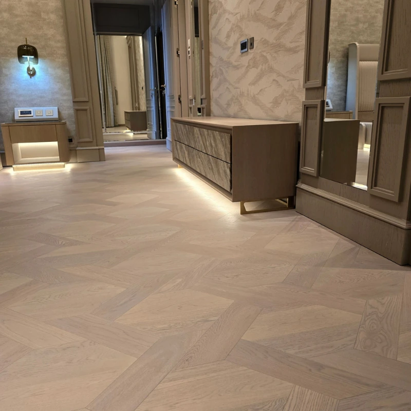 Geometric patterned semi-solid wood floor in a hallway