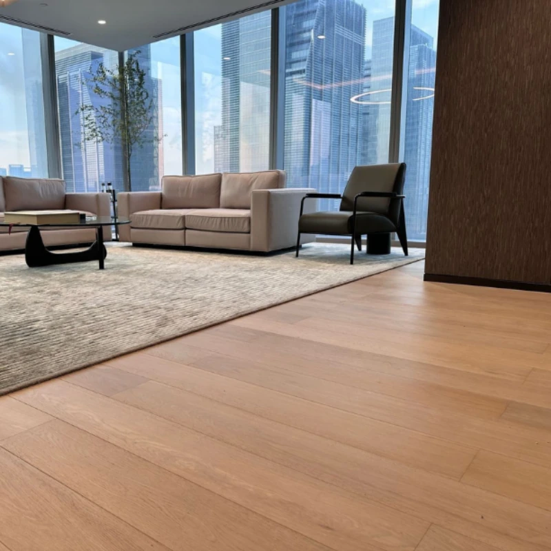 Natural oak semi-solid floor by floor-to-ceiling windows