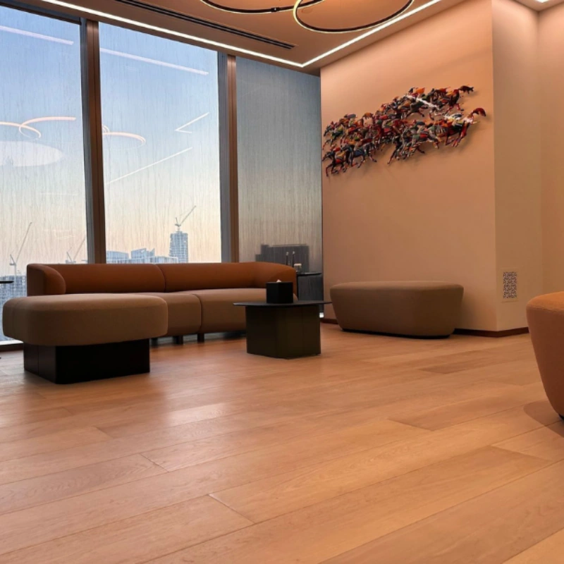 Polished semi-solid wood planks in a sunlit lobby